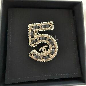 CHANEL Gold-Tone Number 5 Chain-Detail Brooch with Black Leather Weave